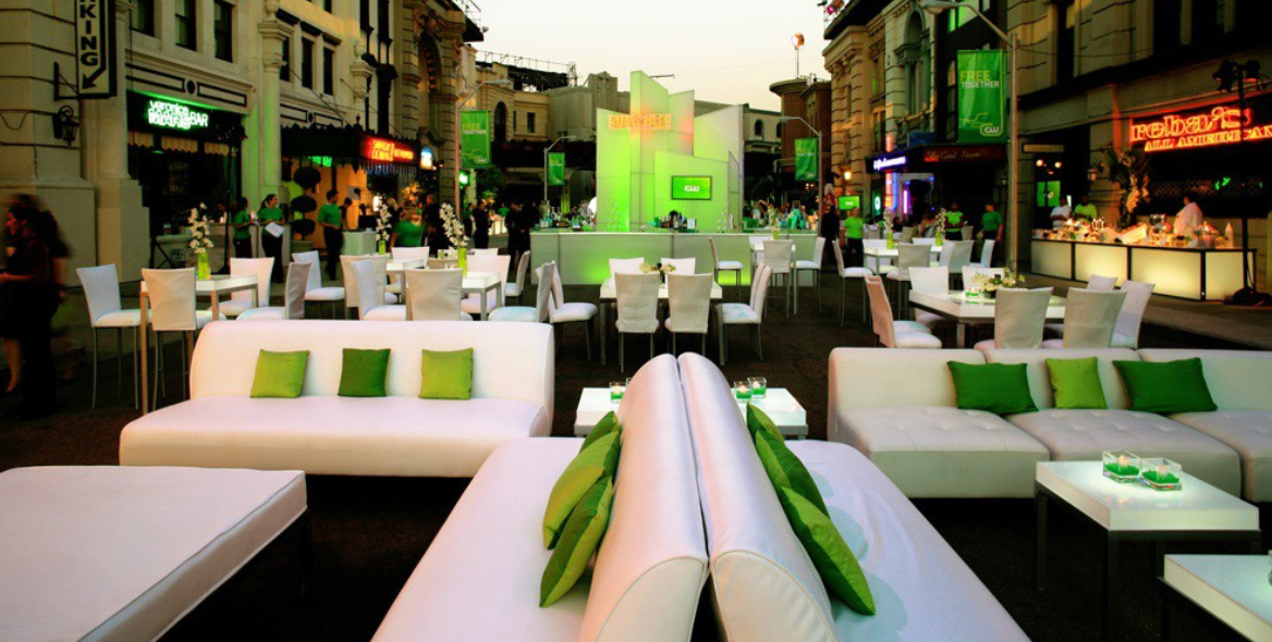 Event venue with tables and chairs arranged in an elegant layout, creating a welcoming and organised atmosphere.