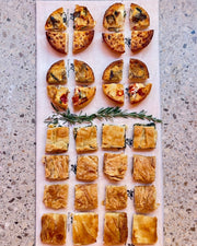 Delight your guests with our grazing platters in Barcelona, featuring a selection of freshly prepared quiches and pita filos, perfect for any event or gathering.